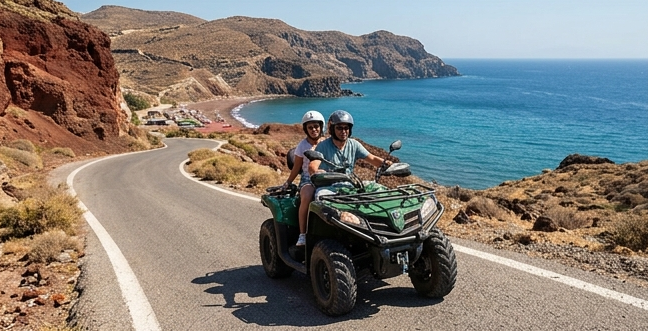 Driving a rental quad bike on the scenic roads leading to the southern beaches of Santorini.