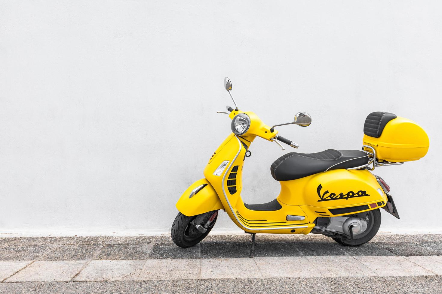 Santorini Moto Rent scooter parked near fira